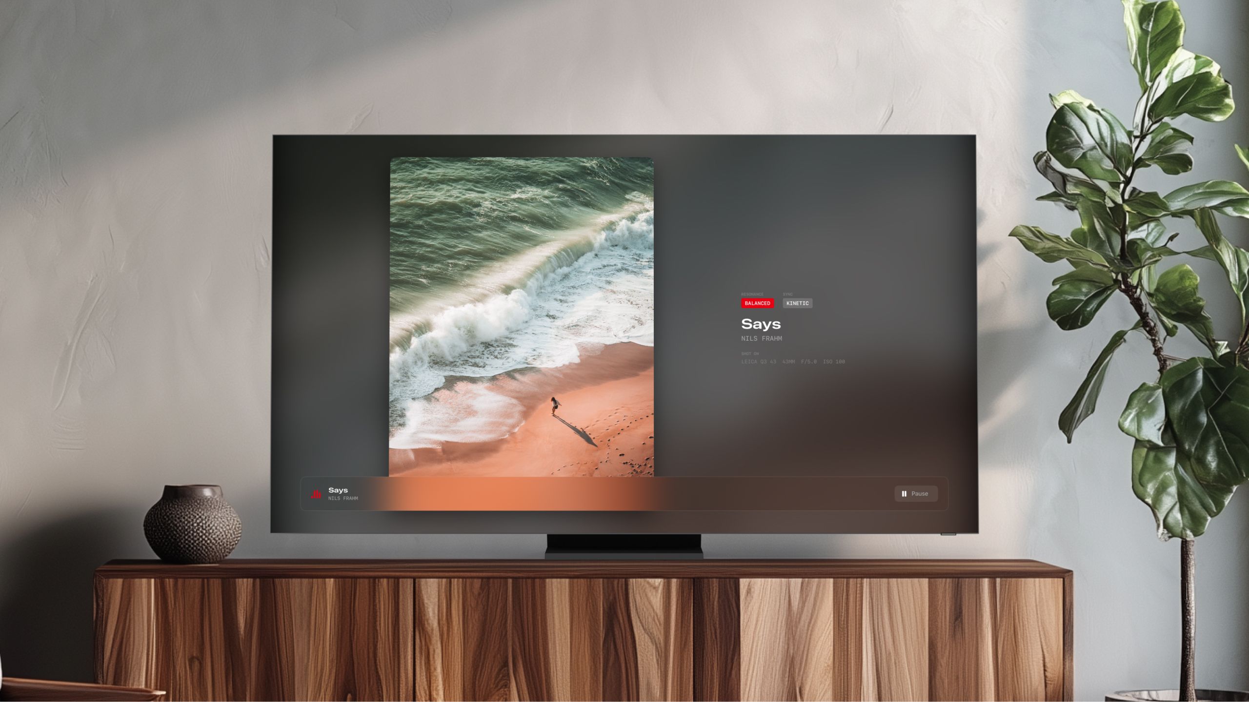 Echo Frame's Apple TV app pairing a photograph with music on a living-room television