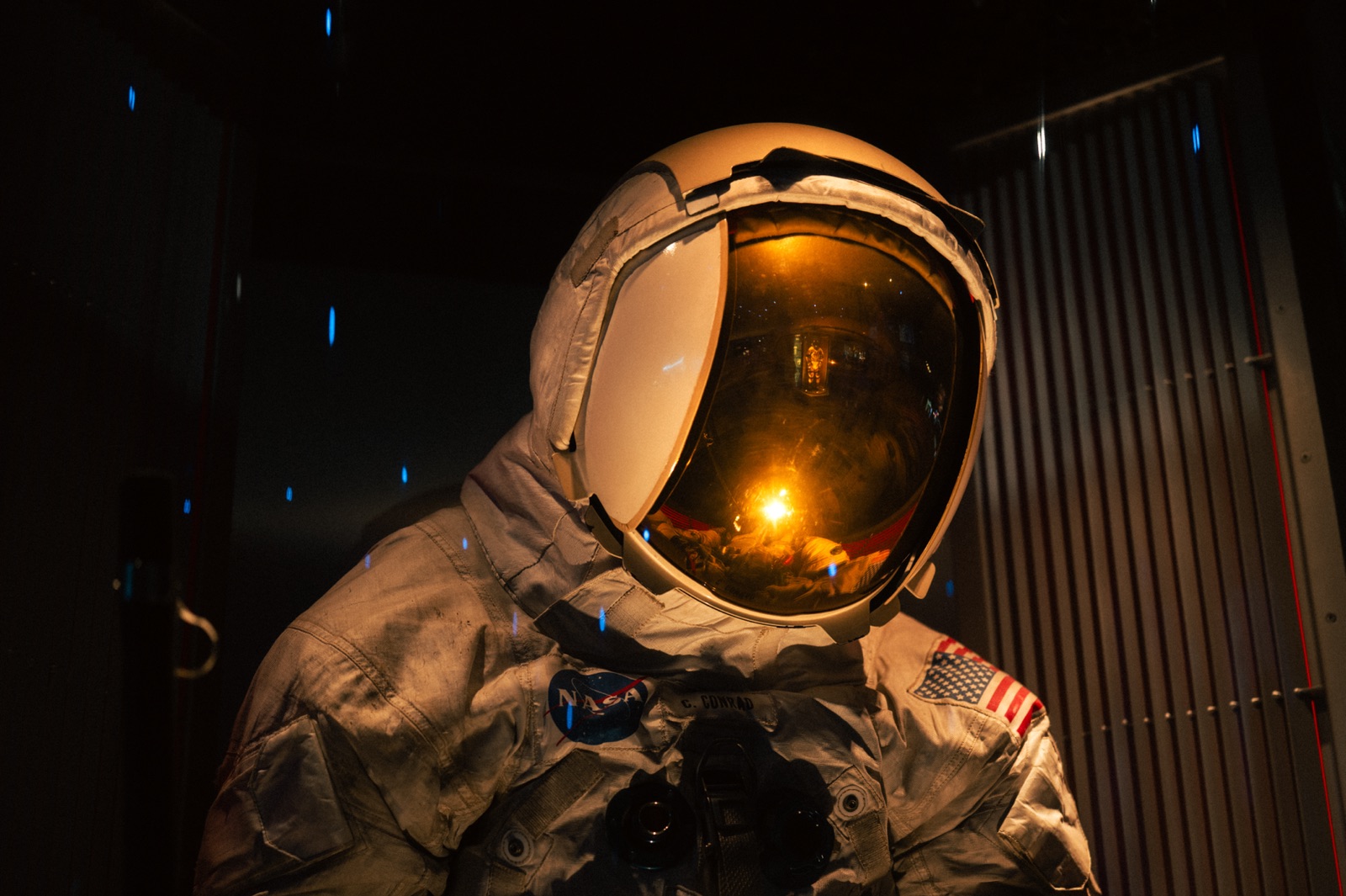 Apollo-era spacesuit, launch light reflected in the gold visor
