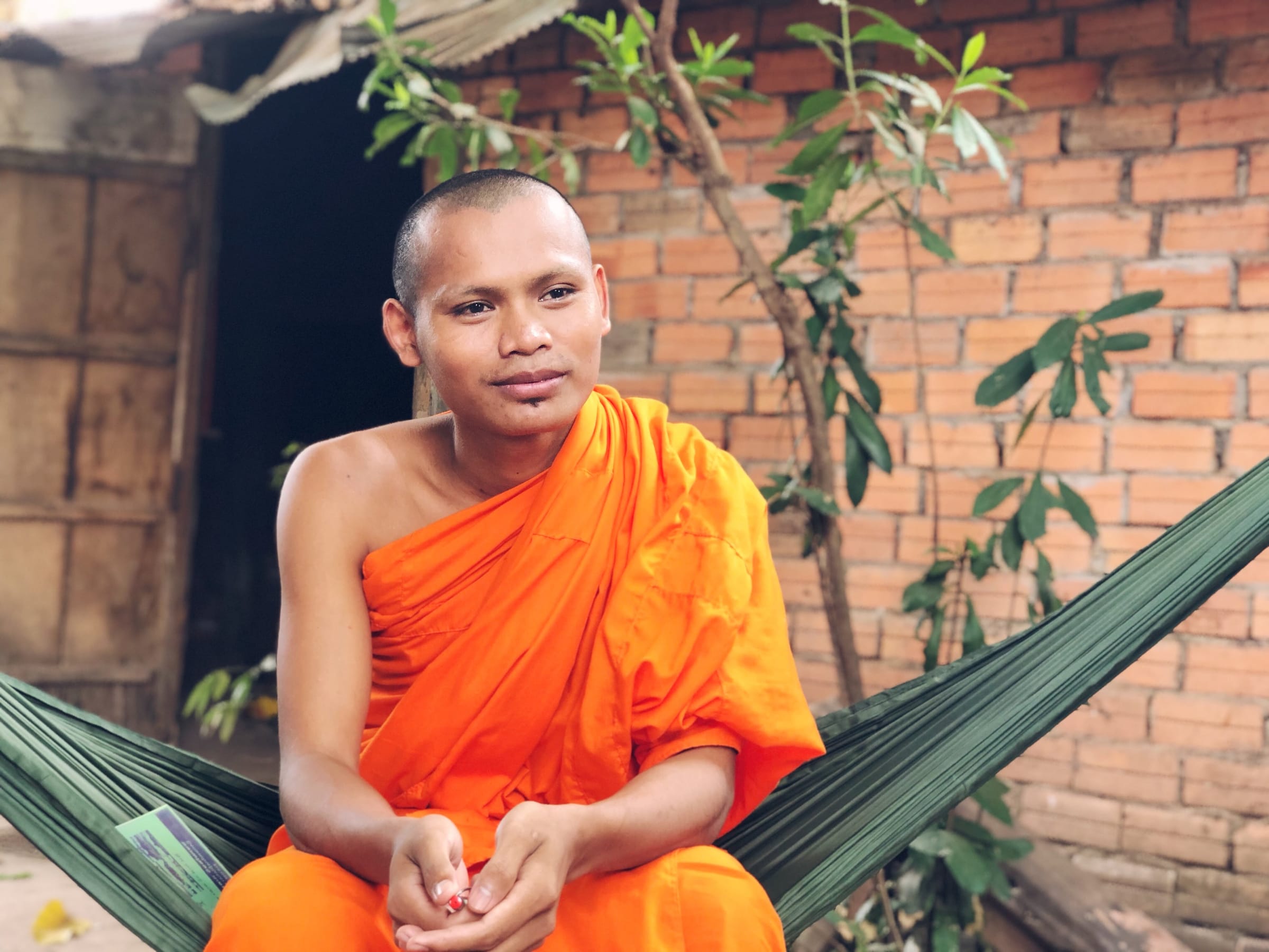 A monk resting in a hammock